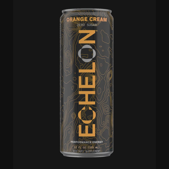 A can of Echelon Orange Cream energy drink spins on a black background.