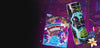 An energy drink and a bag of candy on a colorful, glittery background